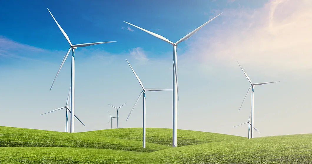 Turbinas de viento en campos verdes